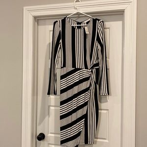 Fitted dress new with tags size large. Calista brand bought from boutique.